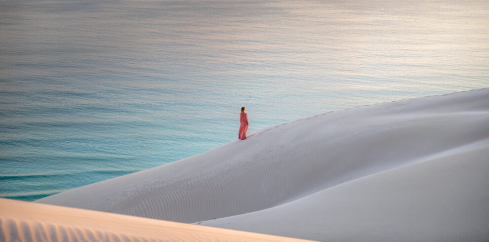 Woman on ahrer dunes on socotra